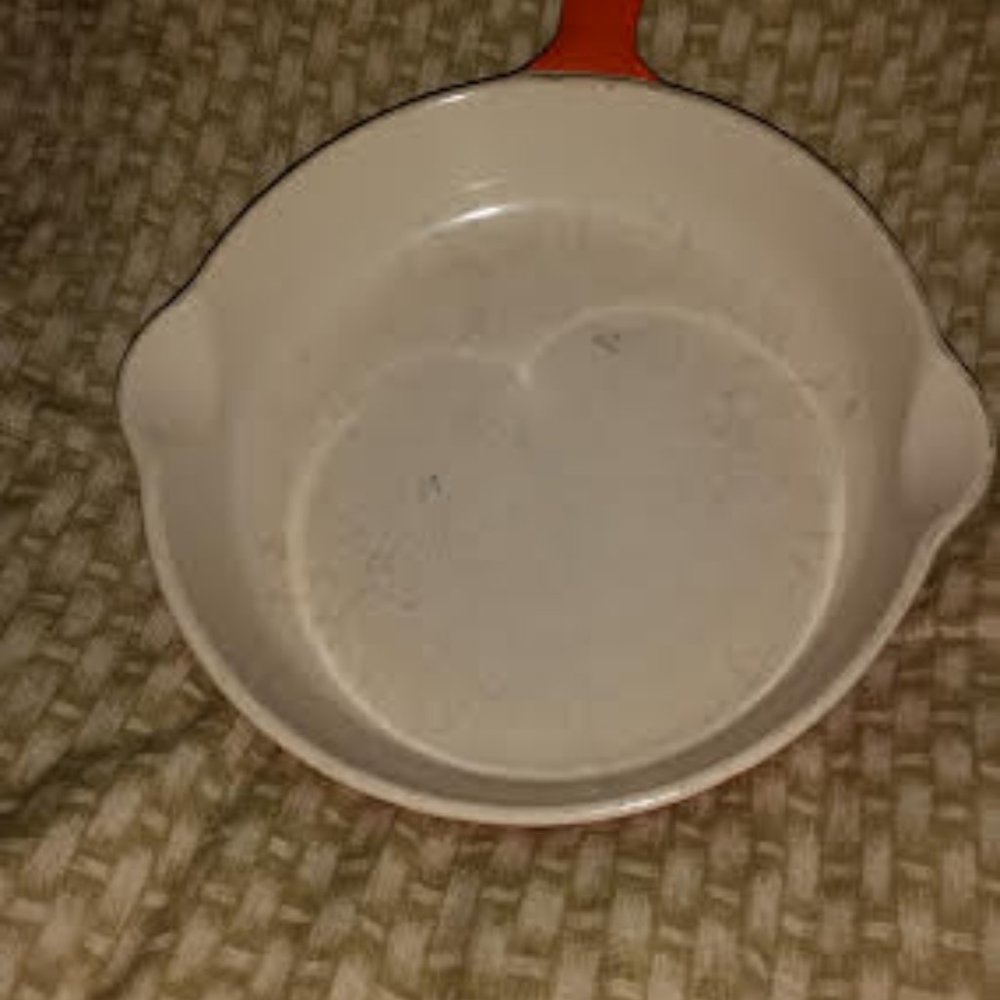 Cast iron coated orange 6 1/2 " diameter